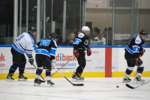 Rookies Rachael Hands and Lliam "Apollo" Patrick man the scorer's box during a Rookies v IBM social game.