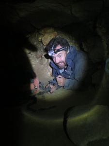 Edging along a particularly narrow part of the illegal catacombs, below Paris. Picture: 'Twist'.